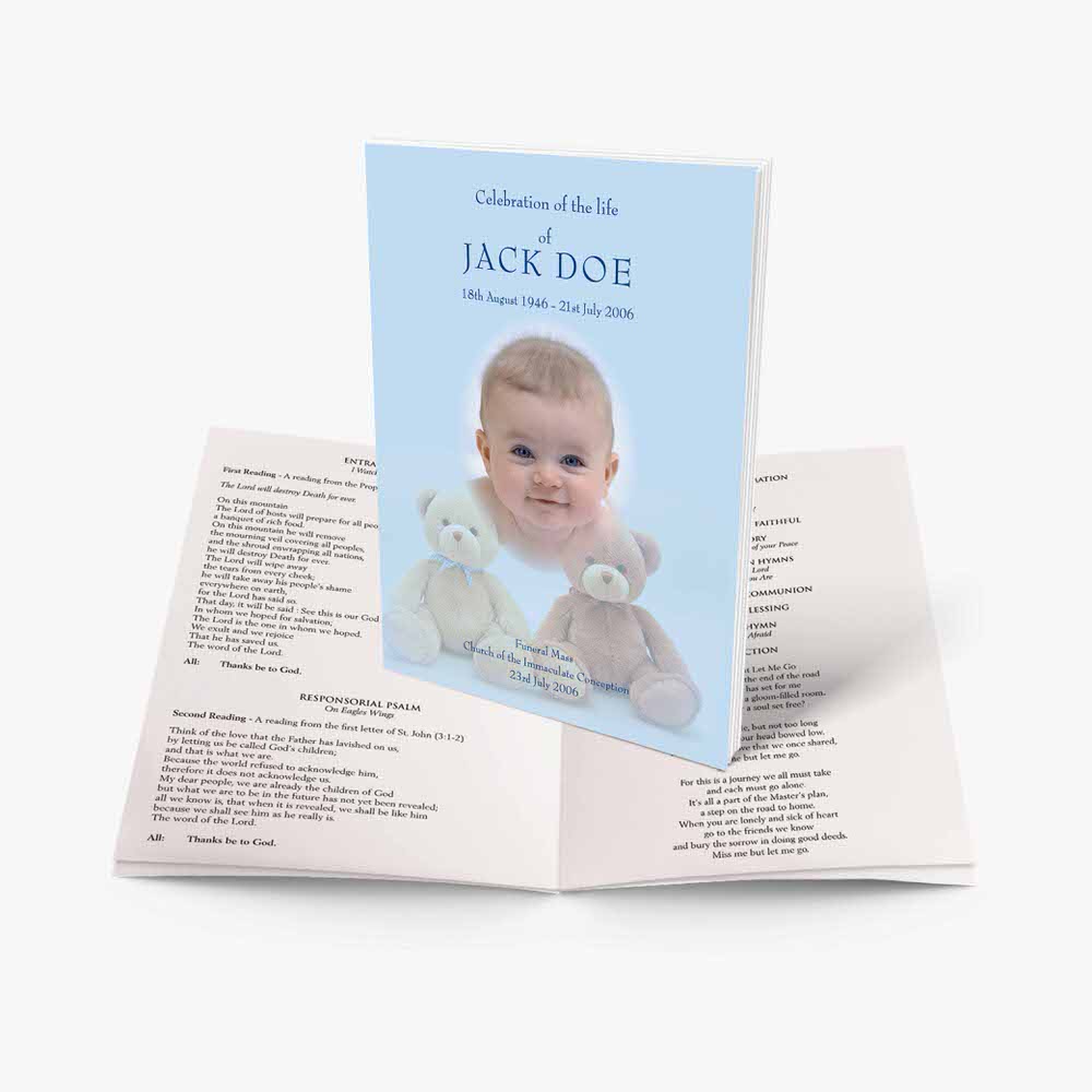 a blue baby book with a teddy bear on the front and a baby's name on the
