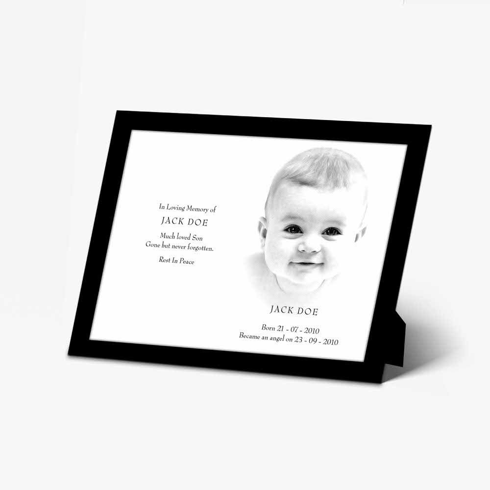 a black and white photo of a baby in a frame