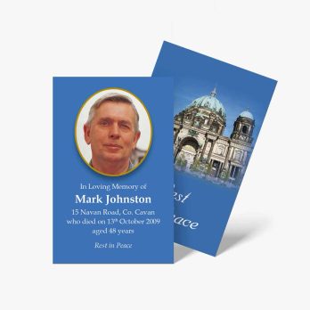 a blue and white funeral card with a photo of a church