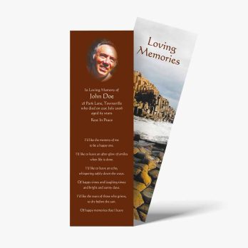 a memorial bookmark with a photo of a man on a rock