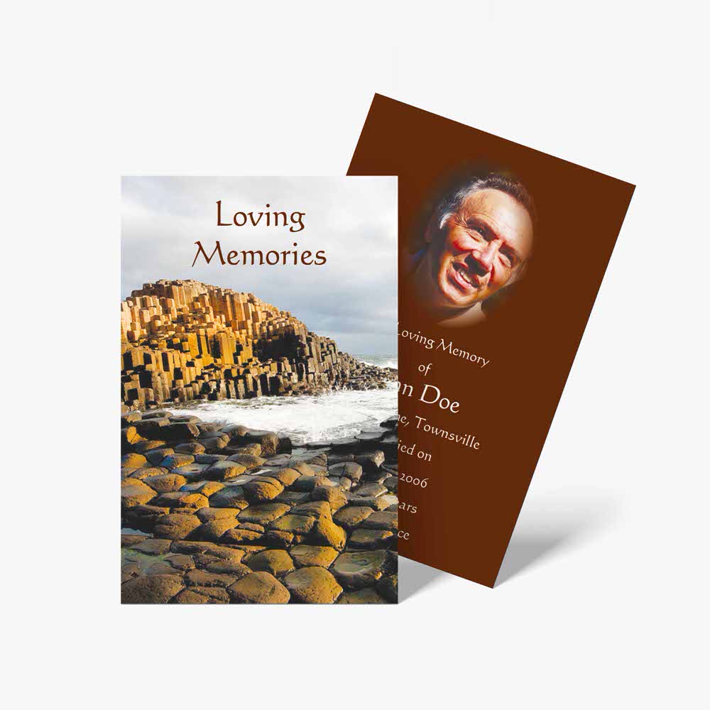 a memorial card with a photo of a man on a rock