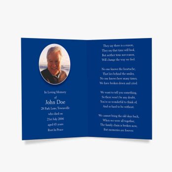 a blue funeral card with a photo of a man in a blue suit