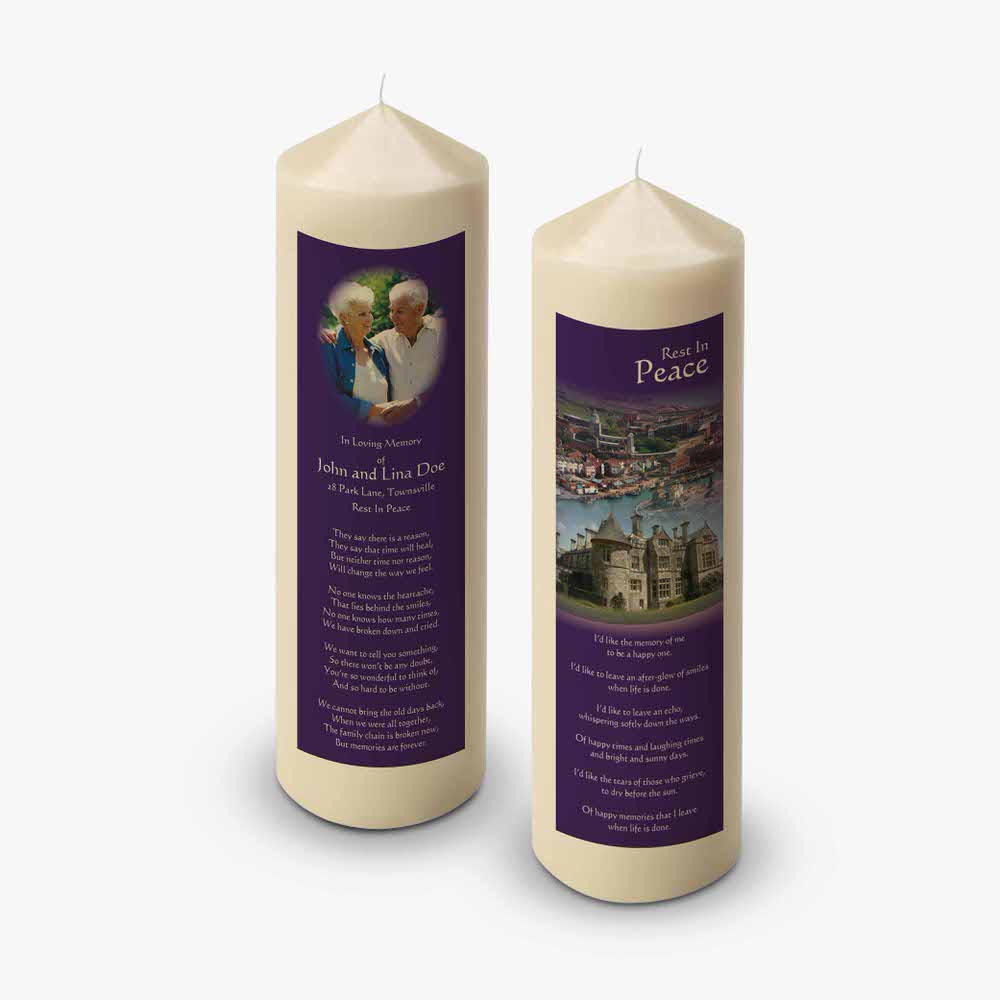 two candles with a picture of a castle on them
