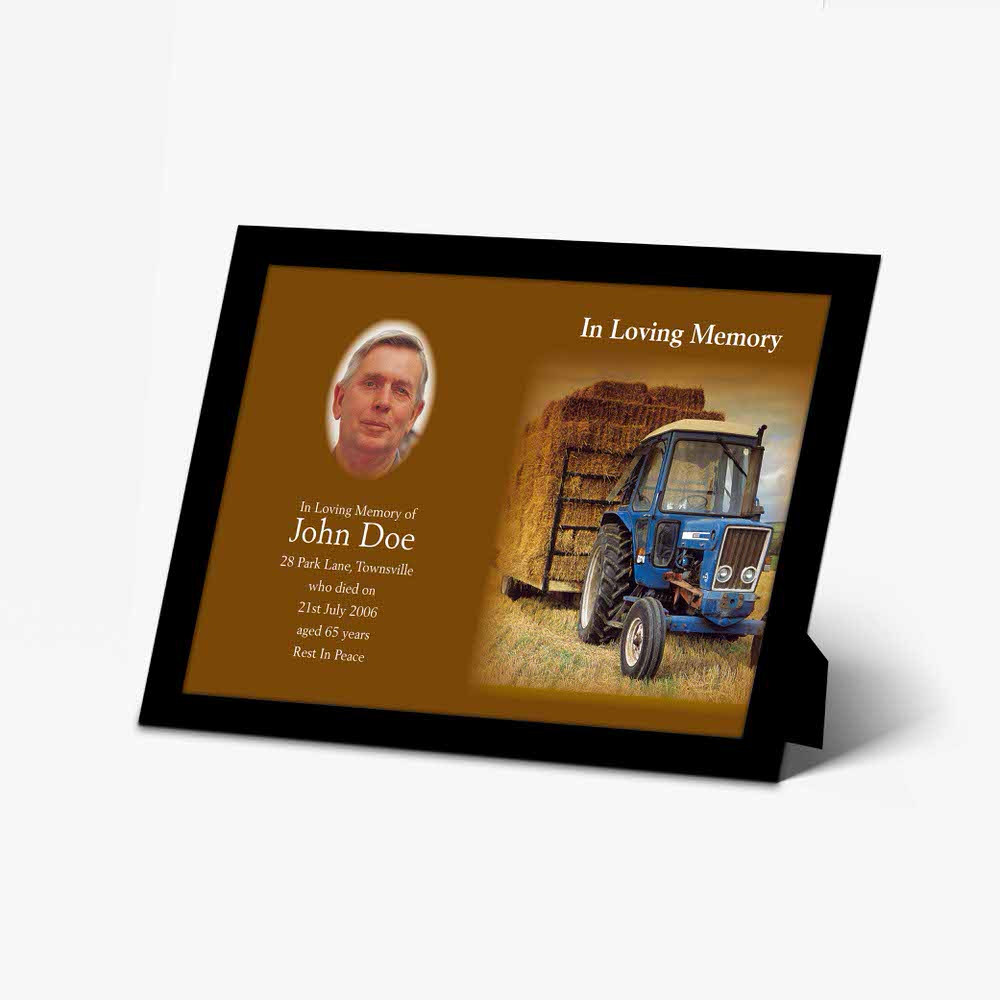 a memorial photo frame with a tractor