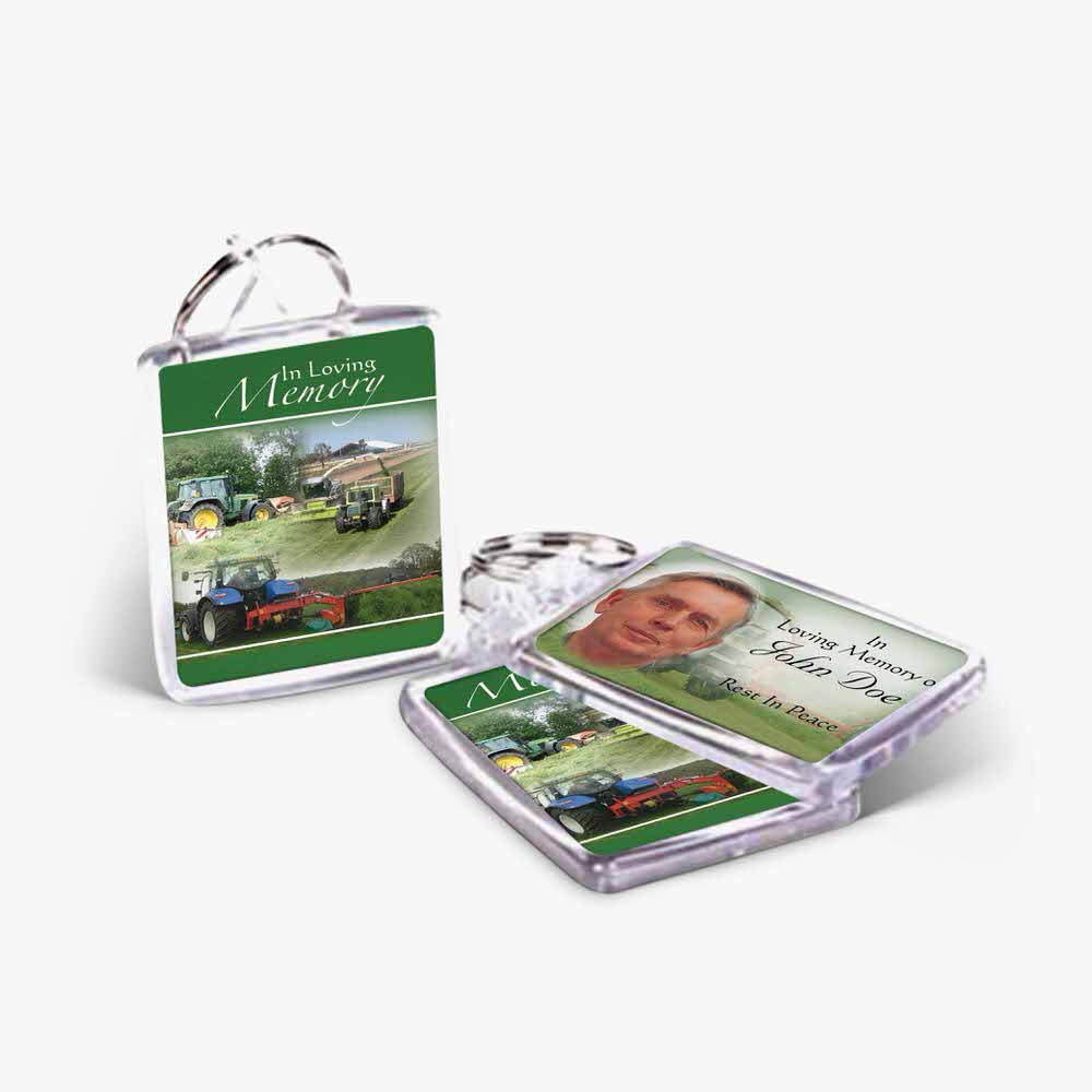 a keychain with a picture of a tractor and a picture of a man