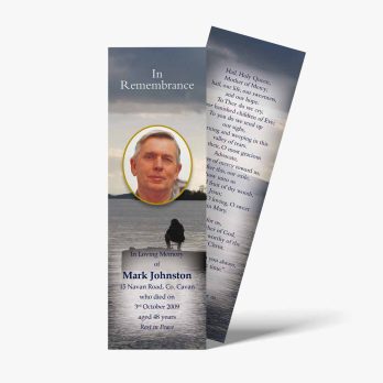 a bookmark with a photo of a man on the water