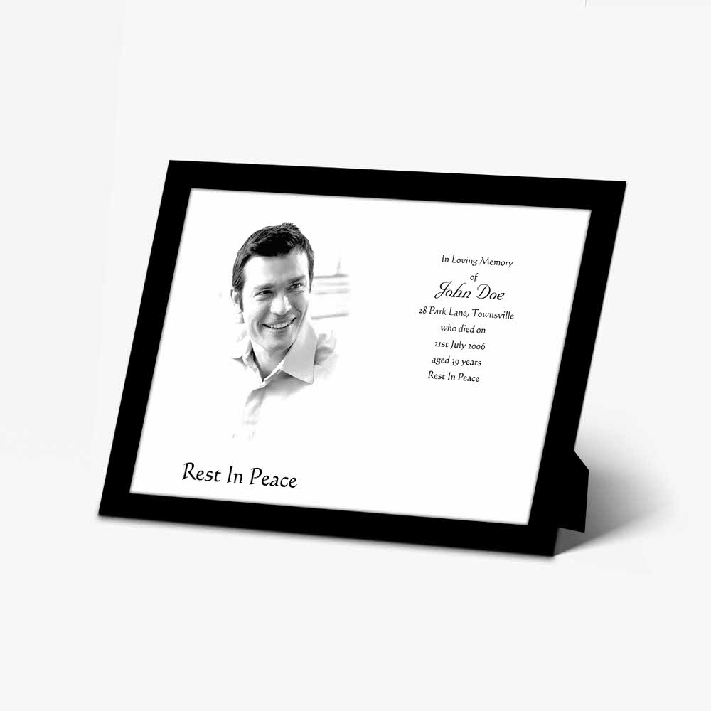 a black and white photo frame with a black and white photo of a man smiling