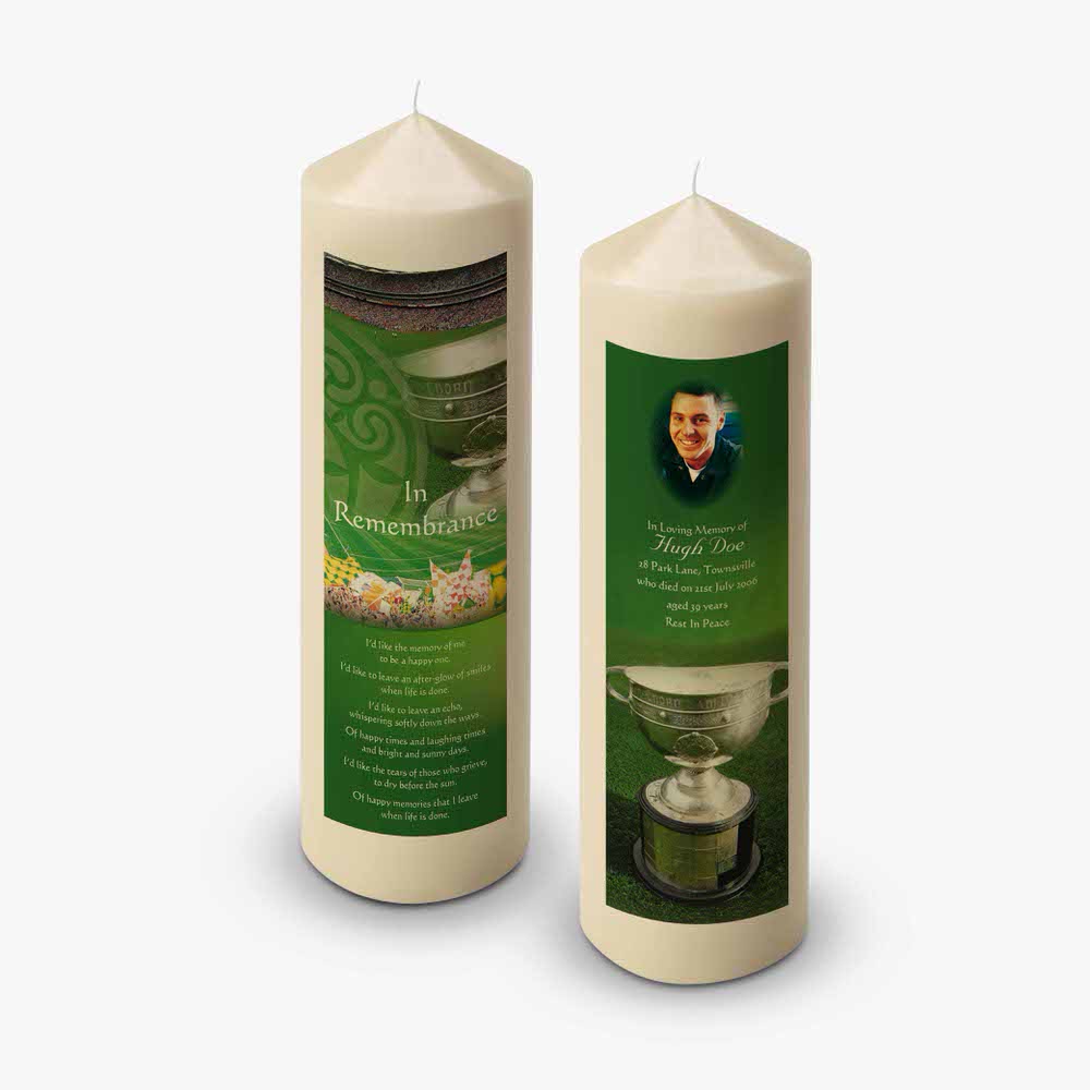 two candles with a green background and a picture of a man