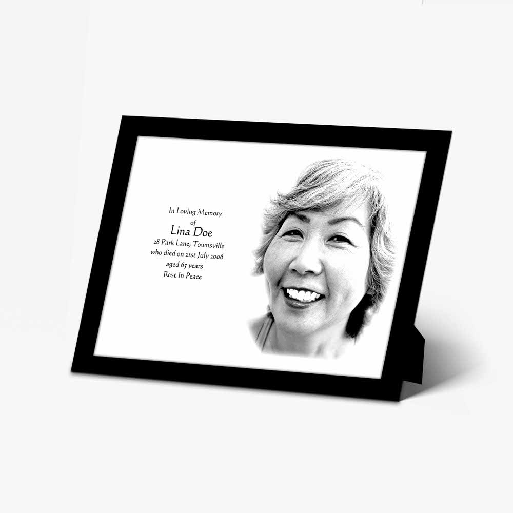 a memorial photo frame with a black and white photo of a woman