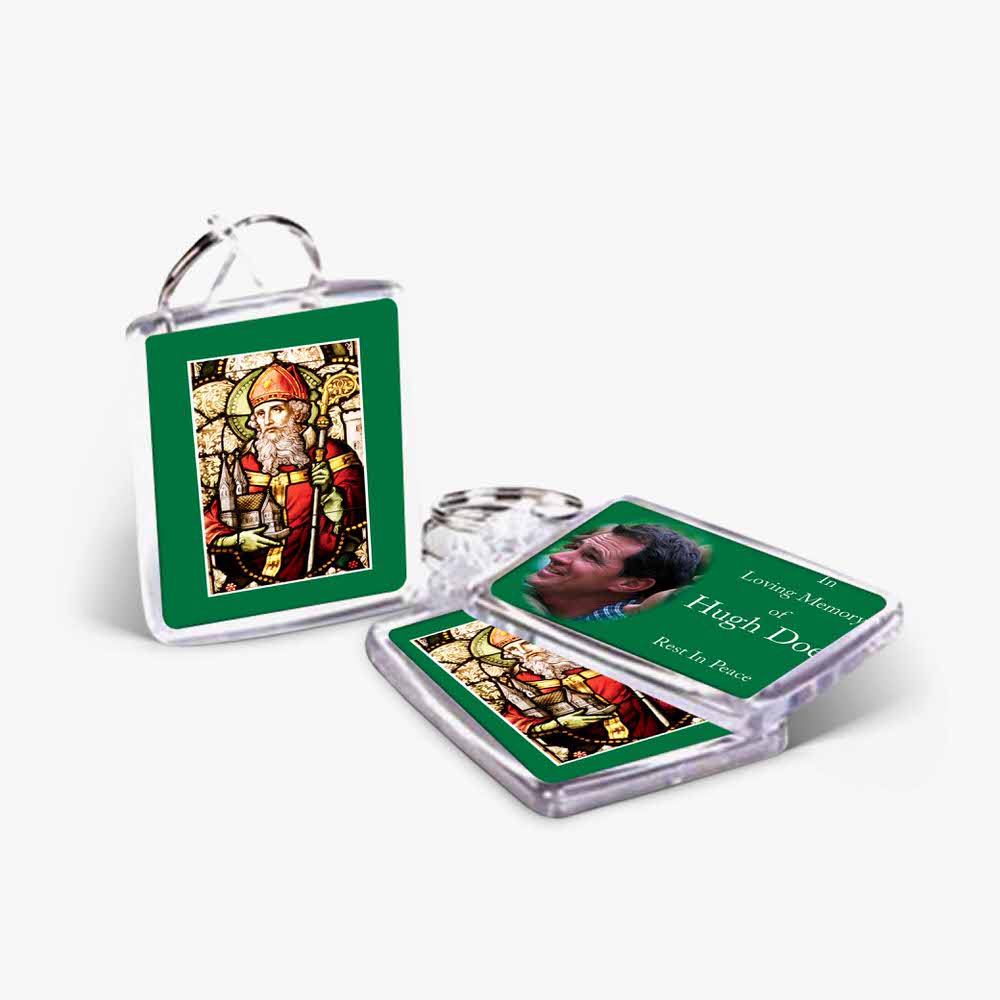 a green keychain with a photo of a person