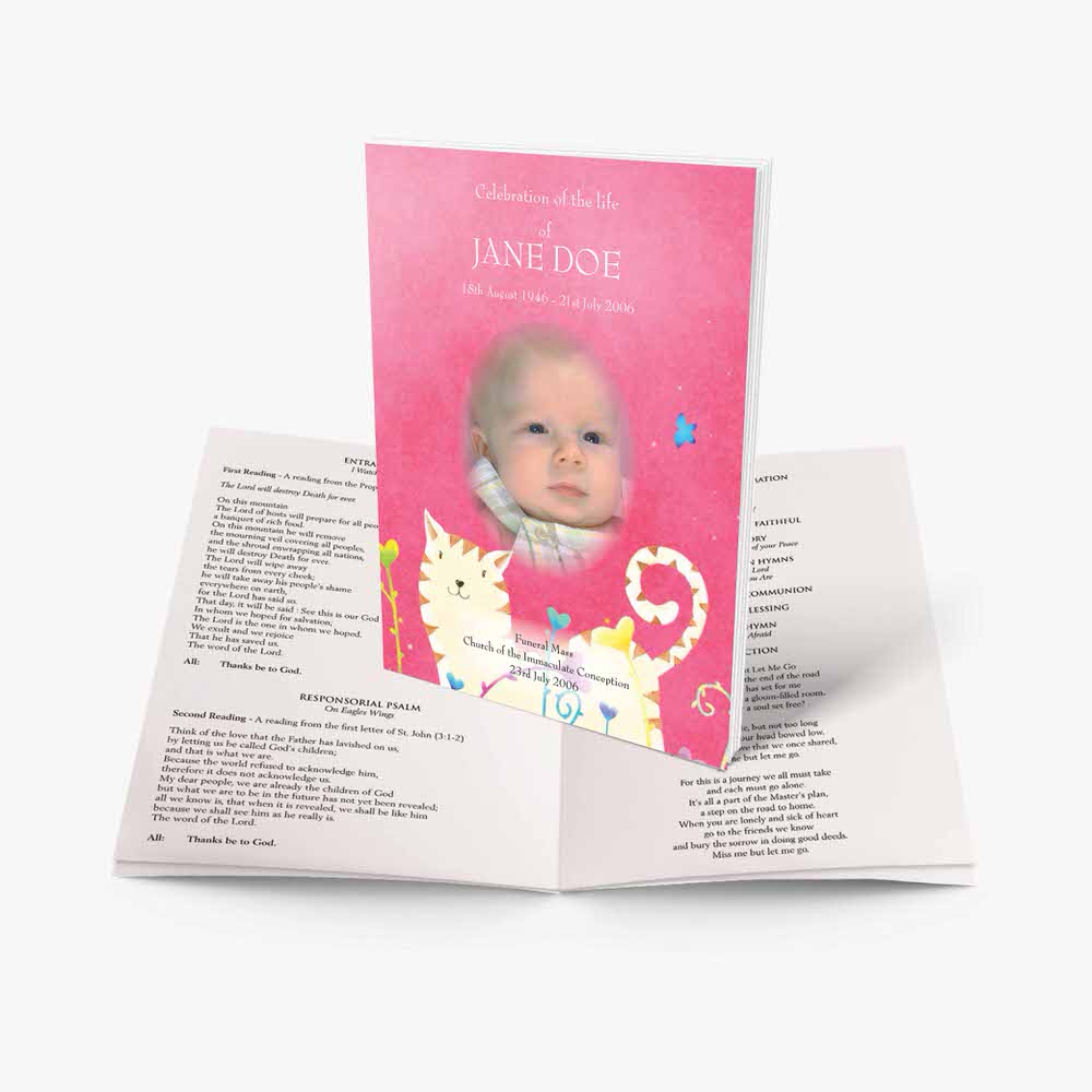 a pink baby baptism booklet with a cat on it
