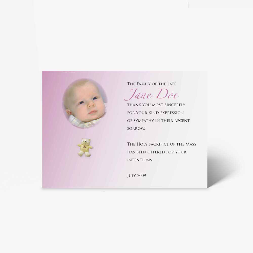 a pink and white baptism card with a photo of a baby