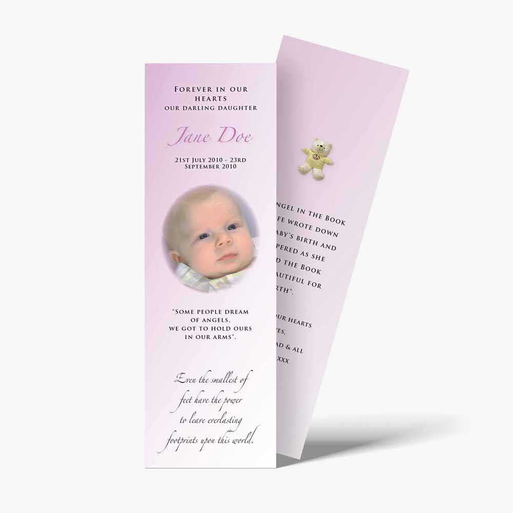a pink bookmark with a baby's photo on it