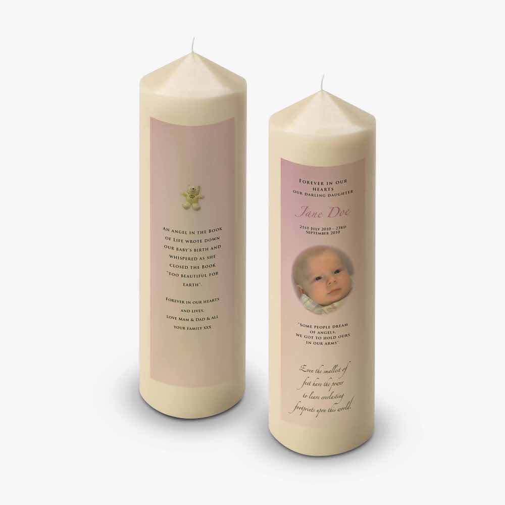 two candles with a photo of a baby on them