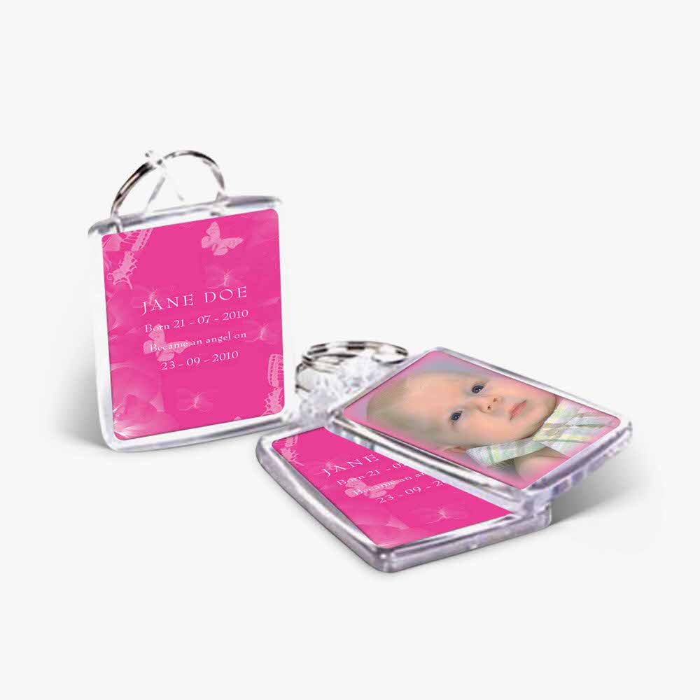 a pink photo frame with a key chain
