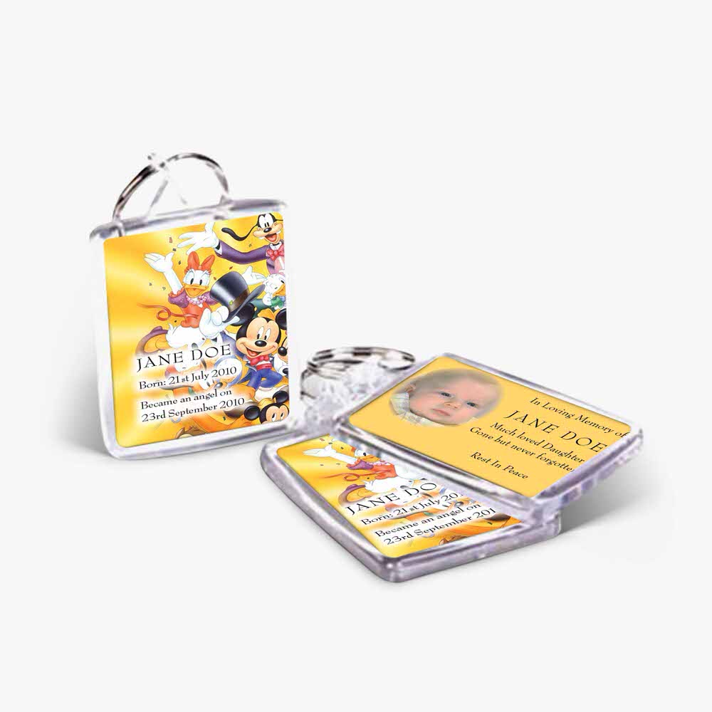 a keychain with a mickey mouse and a yellow keychain