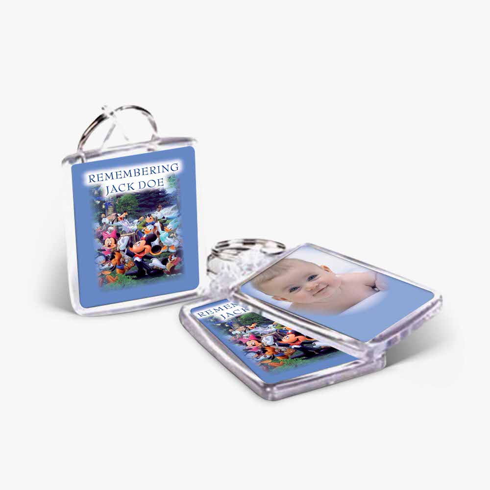 a photo keychain with a picture of a baby and a baby's picture