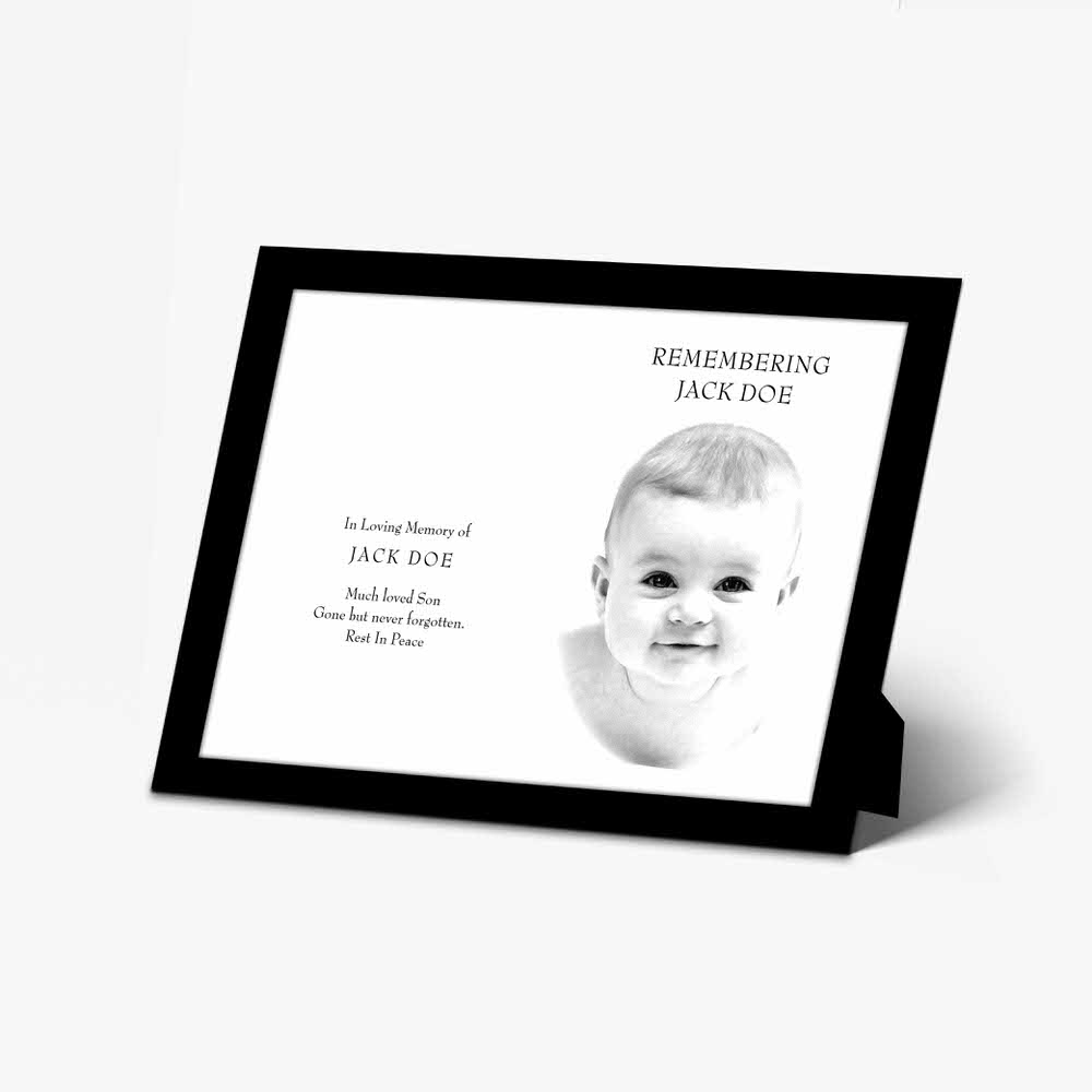 a black and white photo of a baby with a white frame