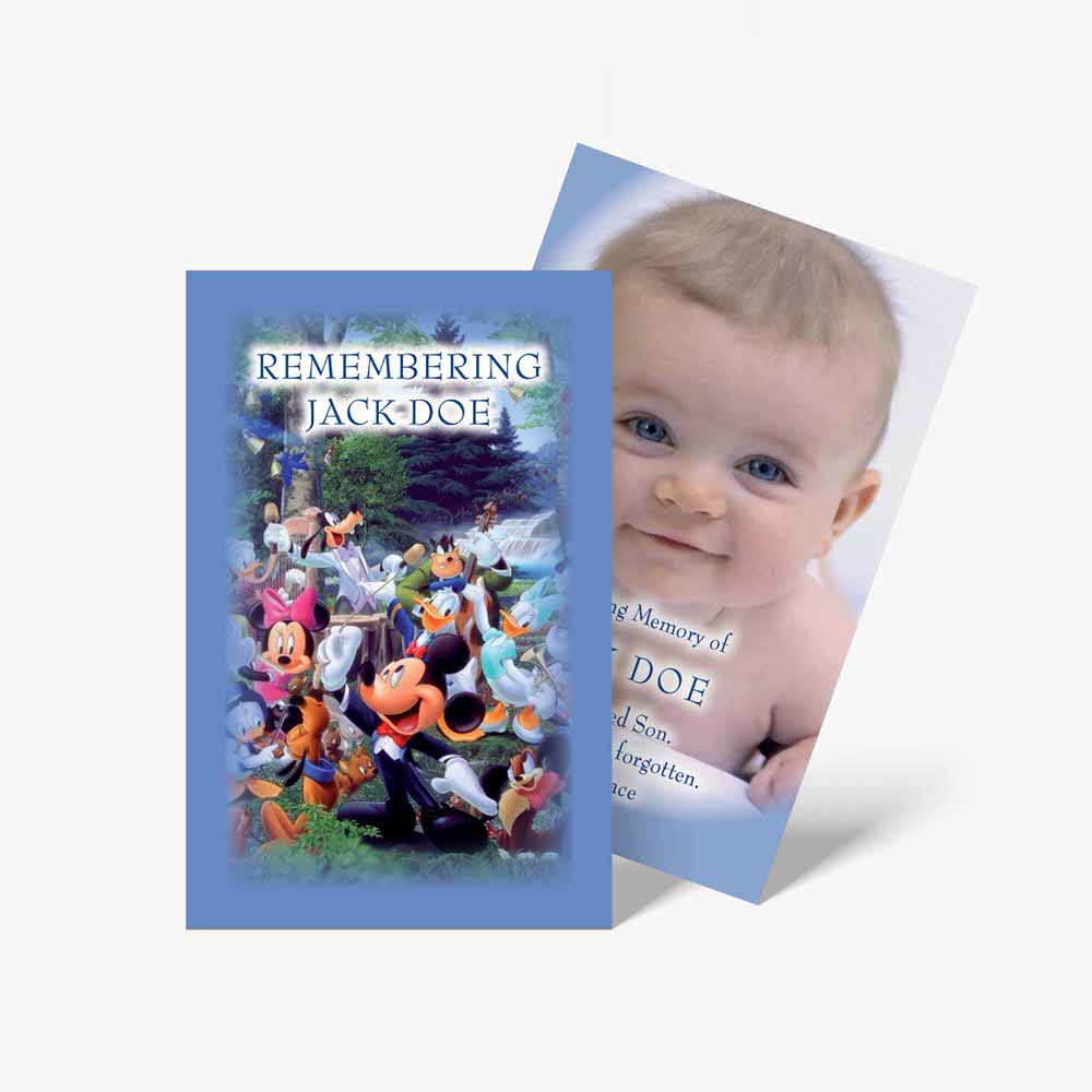a baby's photo and a book with a mickey mouse theme