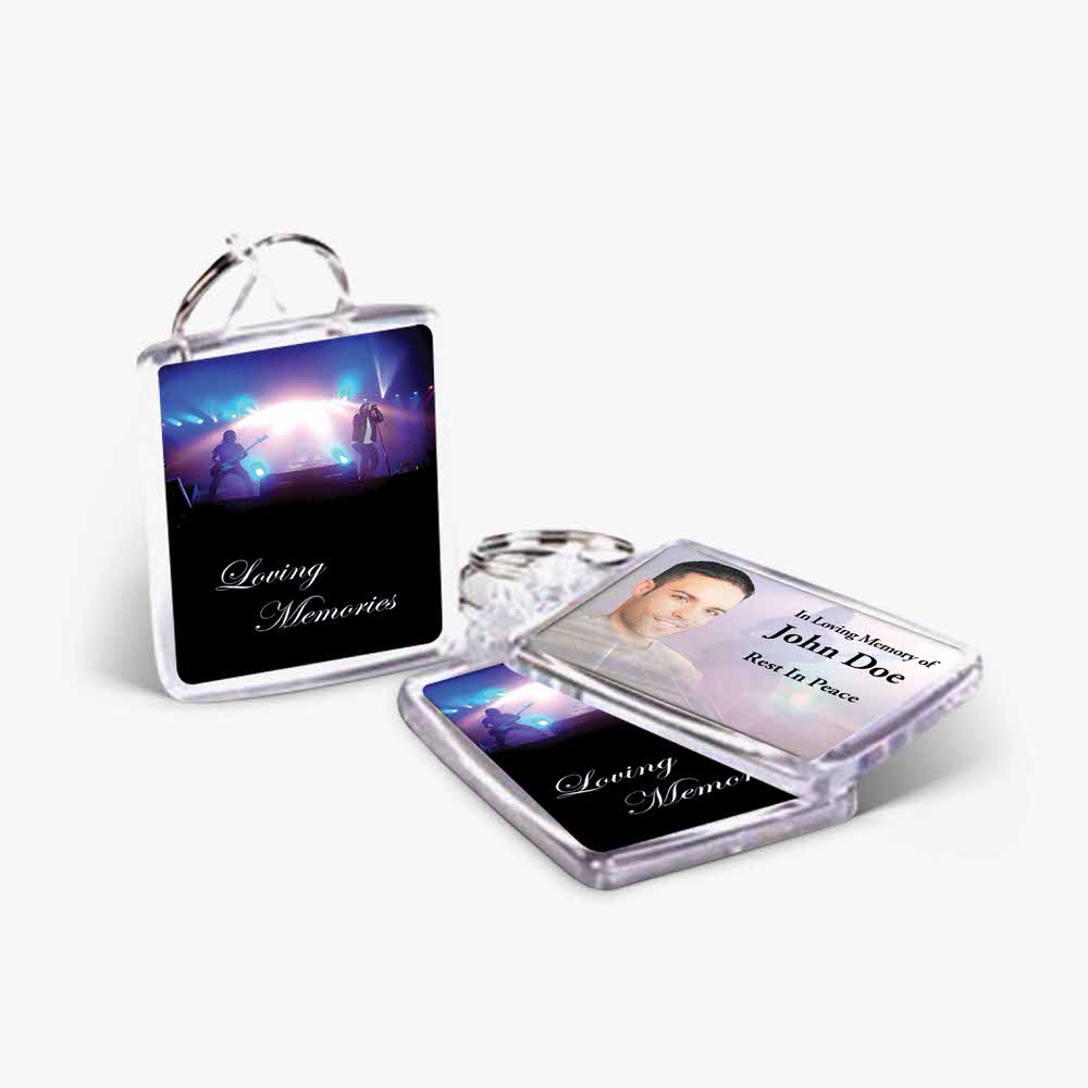 a key chain with a photo of a person and a photo of a concert