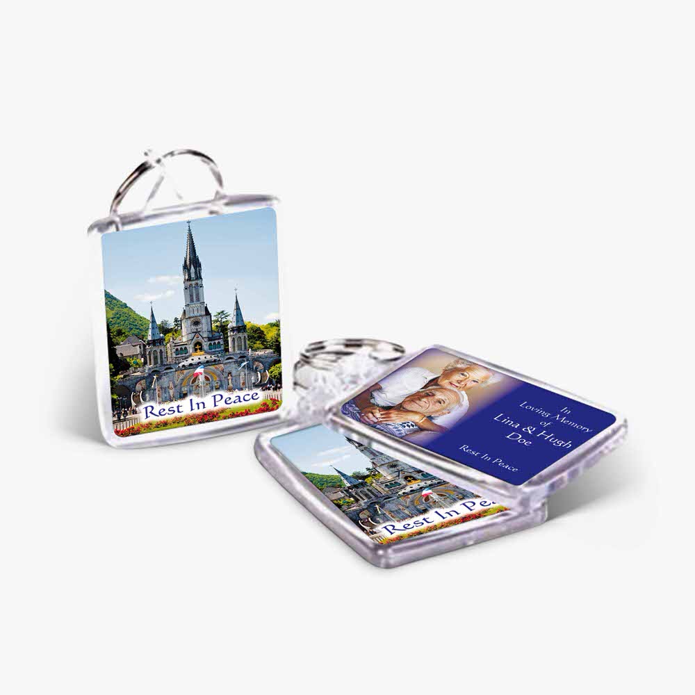 a keychain with a photo of a castle and a card