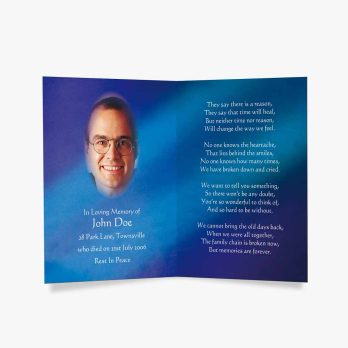 a blue memorial card with a photo of a man in glasses