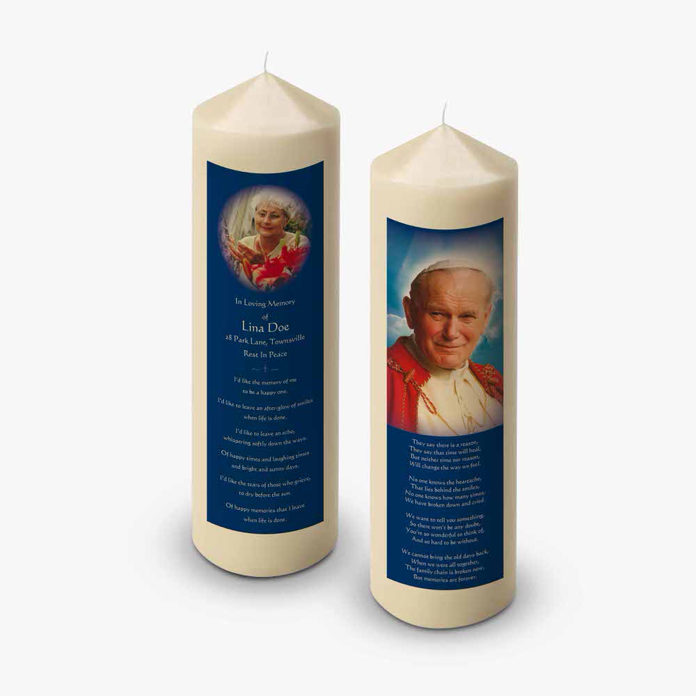 two candles with a photo of pope benedict
