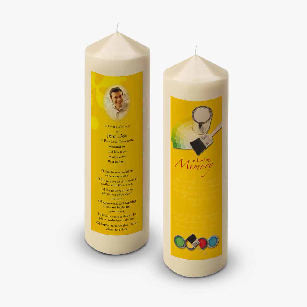 a yellow candle with a picture of a person on it