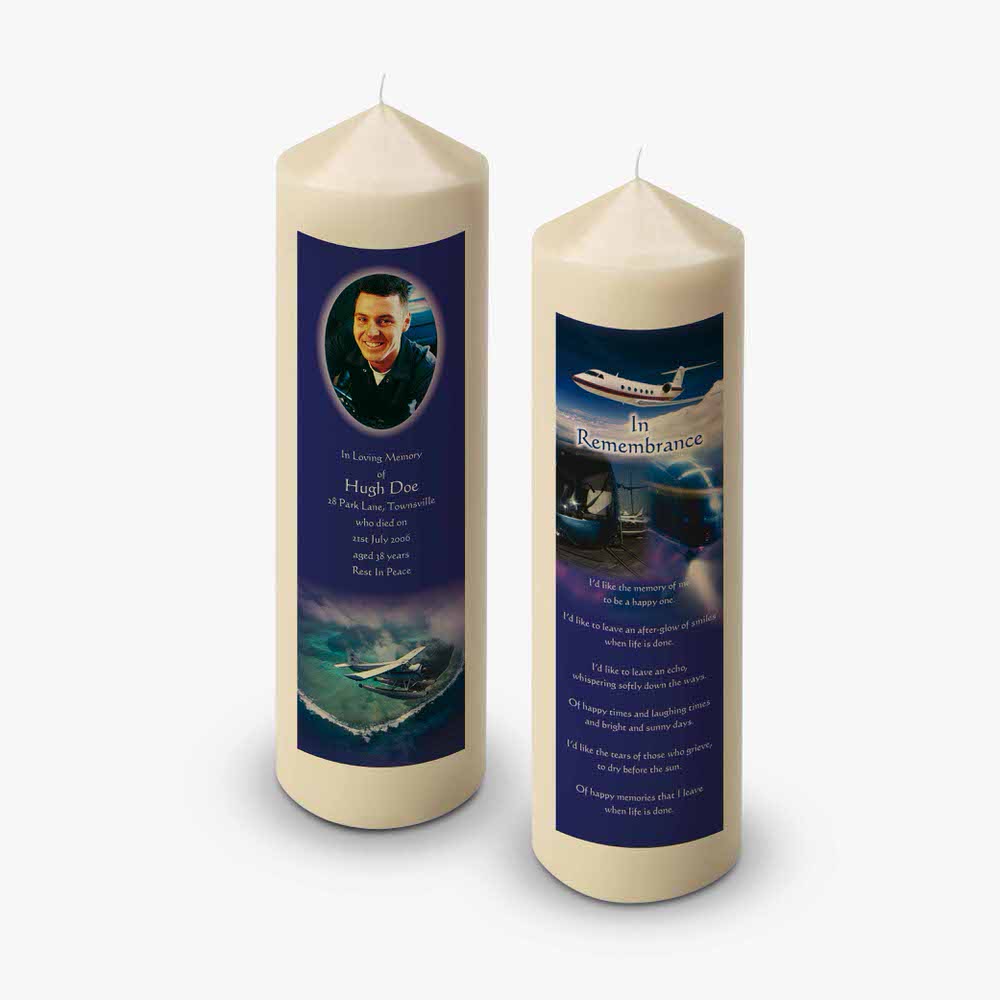 two candles with a picture of a plane on them