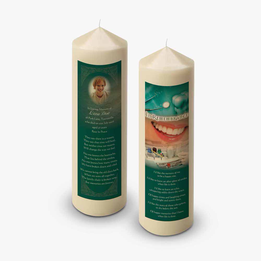 a candle with a picture of a tooth on it