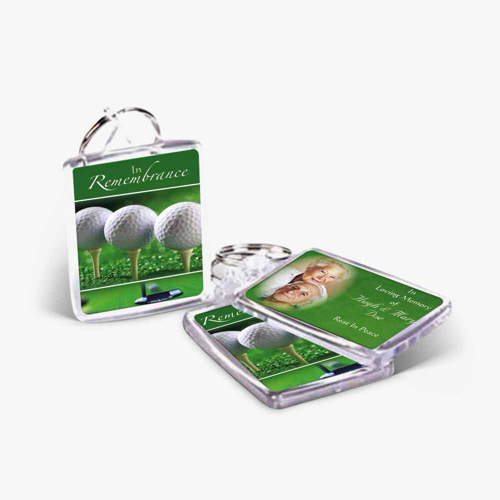 two key chains with a golf ball and a photo