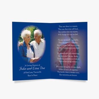 a blue memorial card with a photo of an elderly couple
