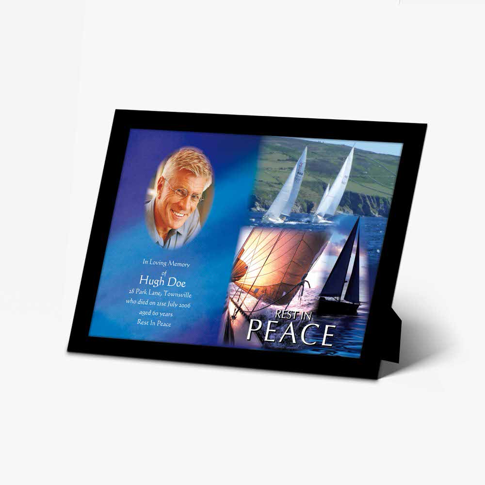 a photo frame with a picture of a sailboat and a quote