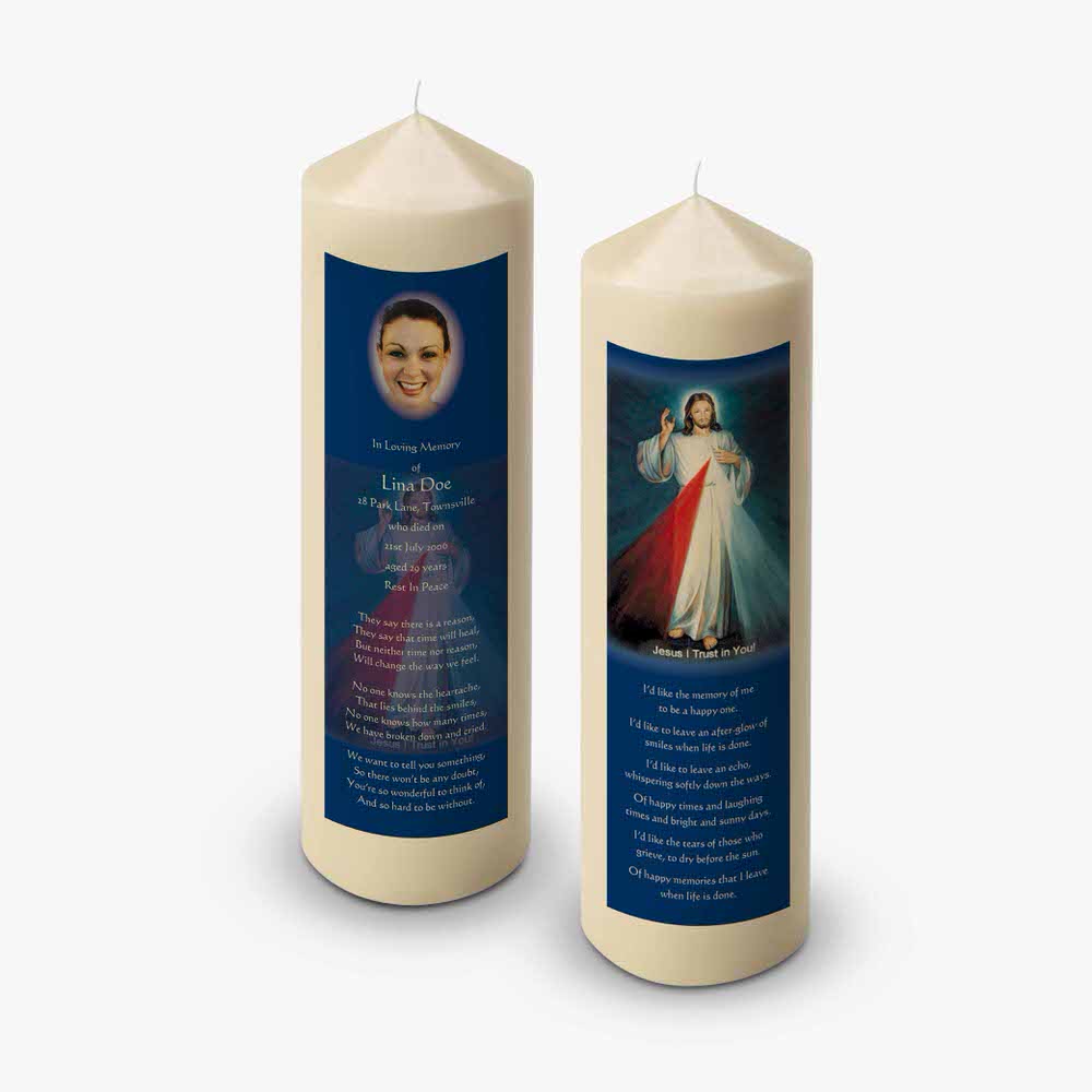 a candle with a picture of mary and a prayer