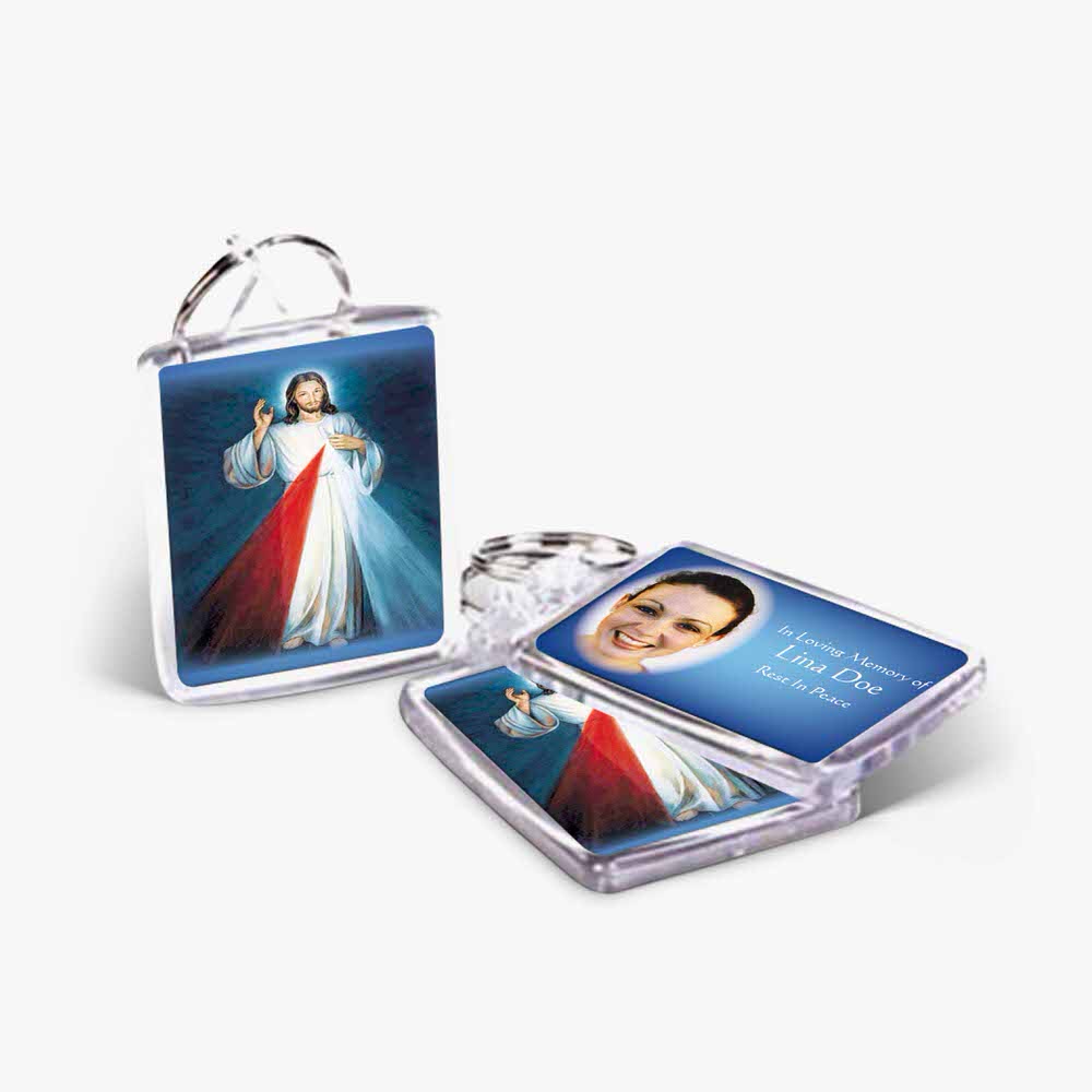 a key chain with a photo of jesus and a cross