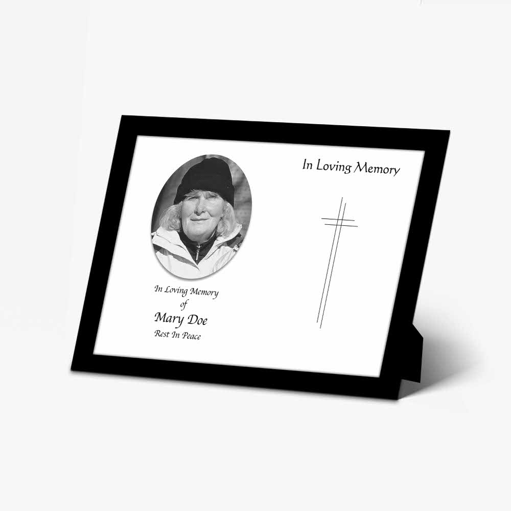 a black and white photo frame with a cross and a picture of a person
