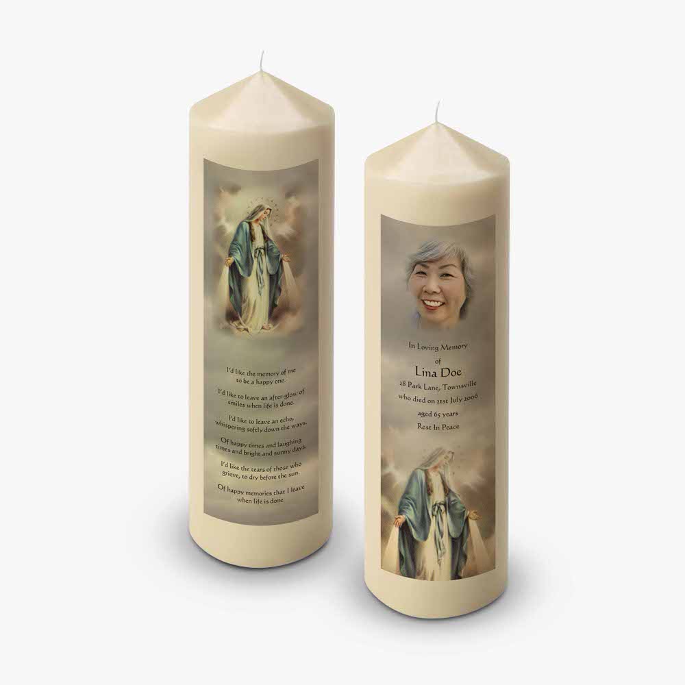 a candle with a photo of mary and a prayer