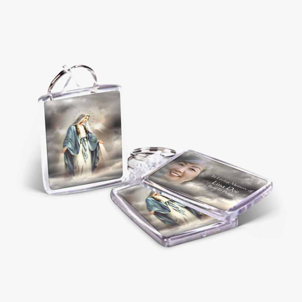 a key chain with a picture of the virgin mary