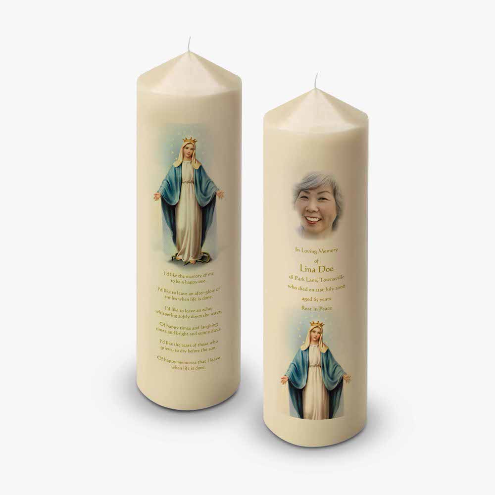 a candle with a picture of mary and a prayer