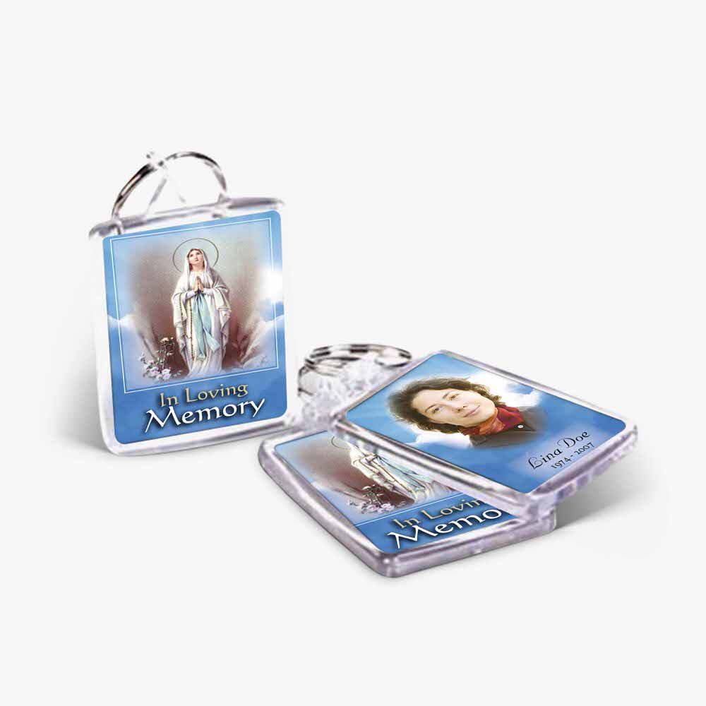 a keychain with a picture of the virgin mary