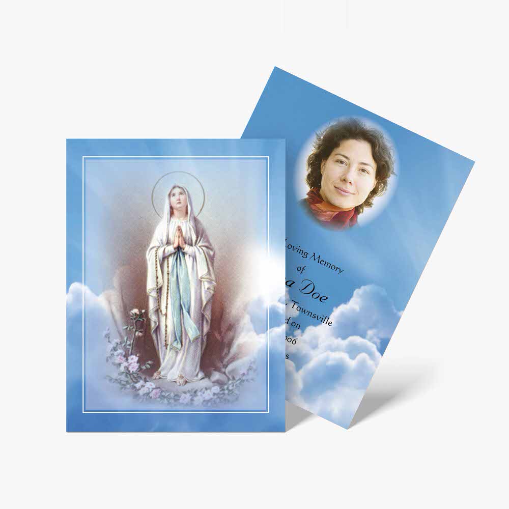 a blue and white card with an image of the virgin mary
