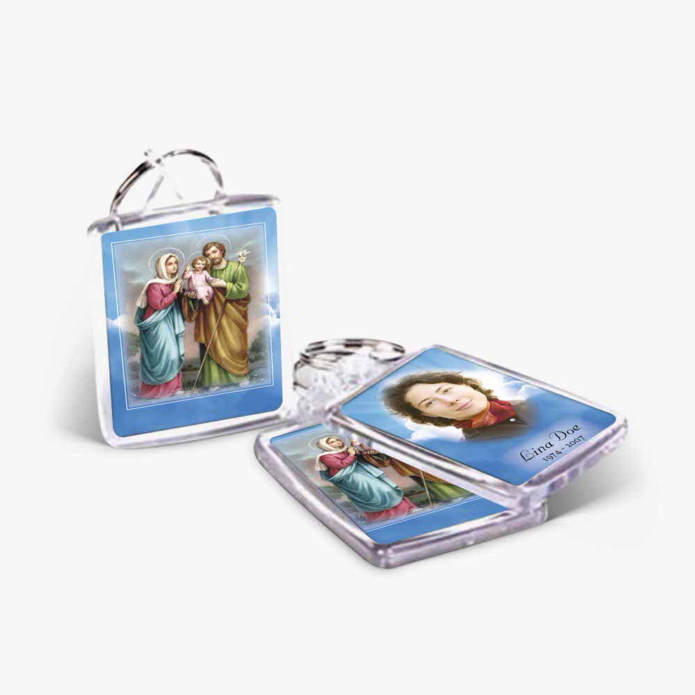 a key chain with a picture of the holy family