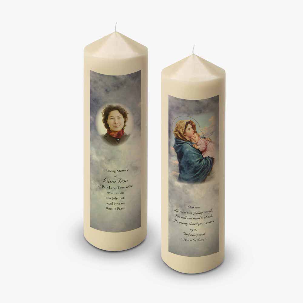 two candles with a picture of a mother and child