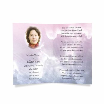 a funeral program with a photo of a woman in a pink and blue sky
