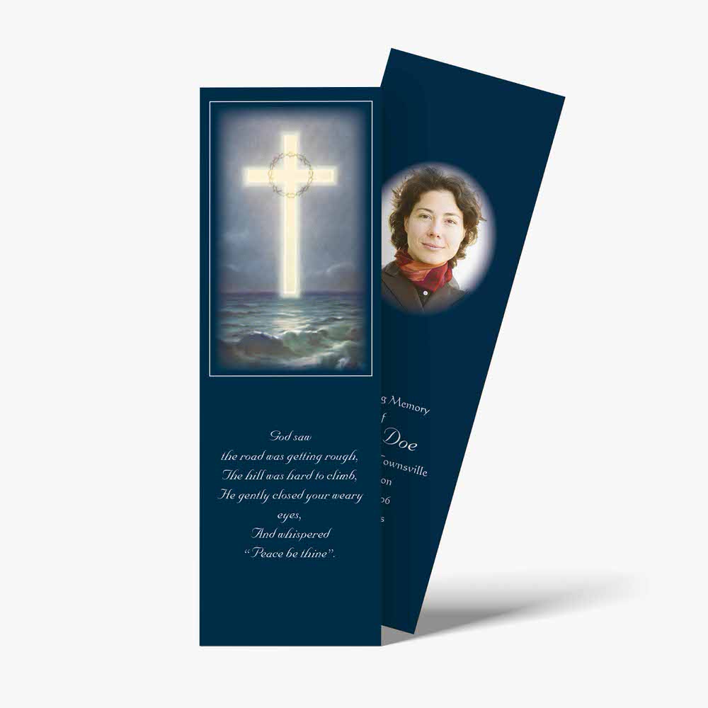 a bookmark with a cross and a picture of a woman
