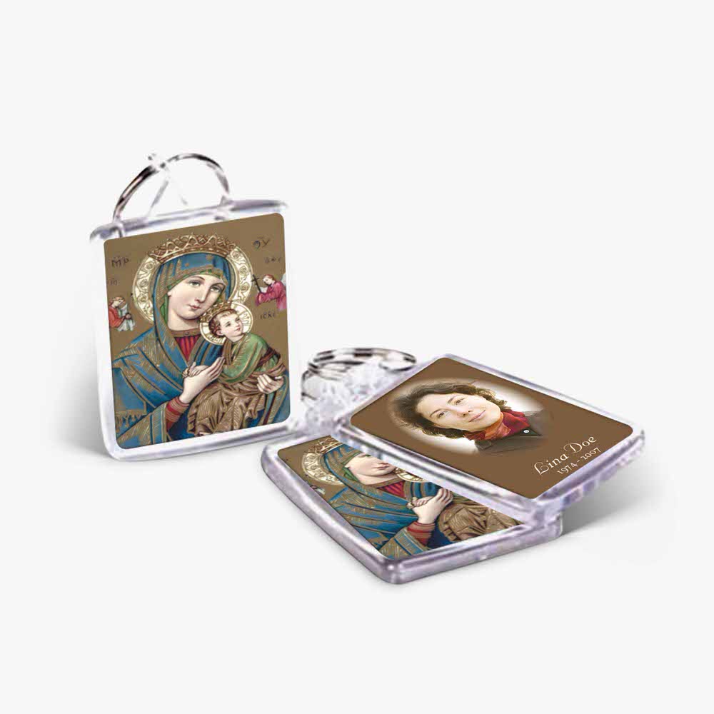 a key chain with a picture of the virgin mary and a picture of the child