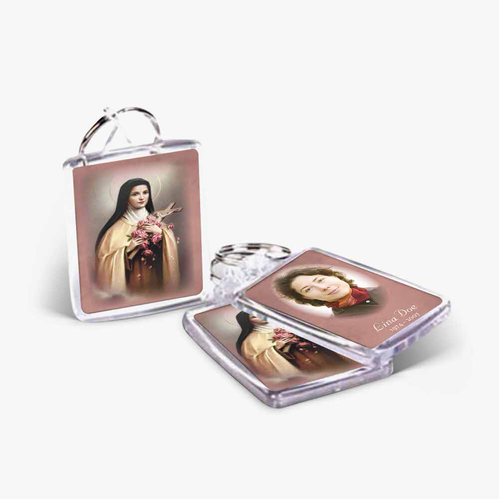 a keychain with a picture of a woman and a picture of the saint