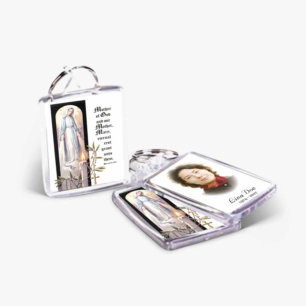 a key chain with a picture of the virgin mary