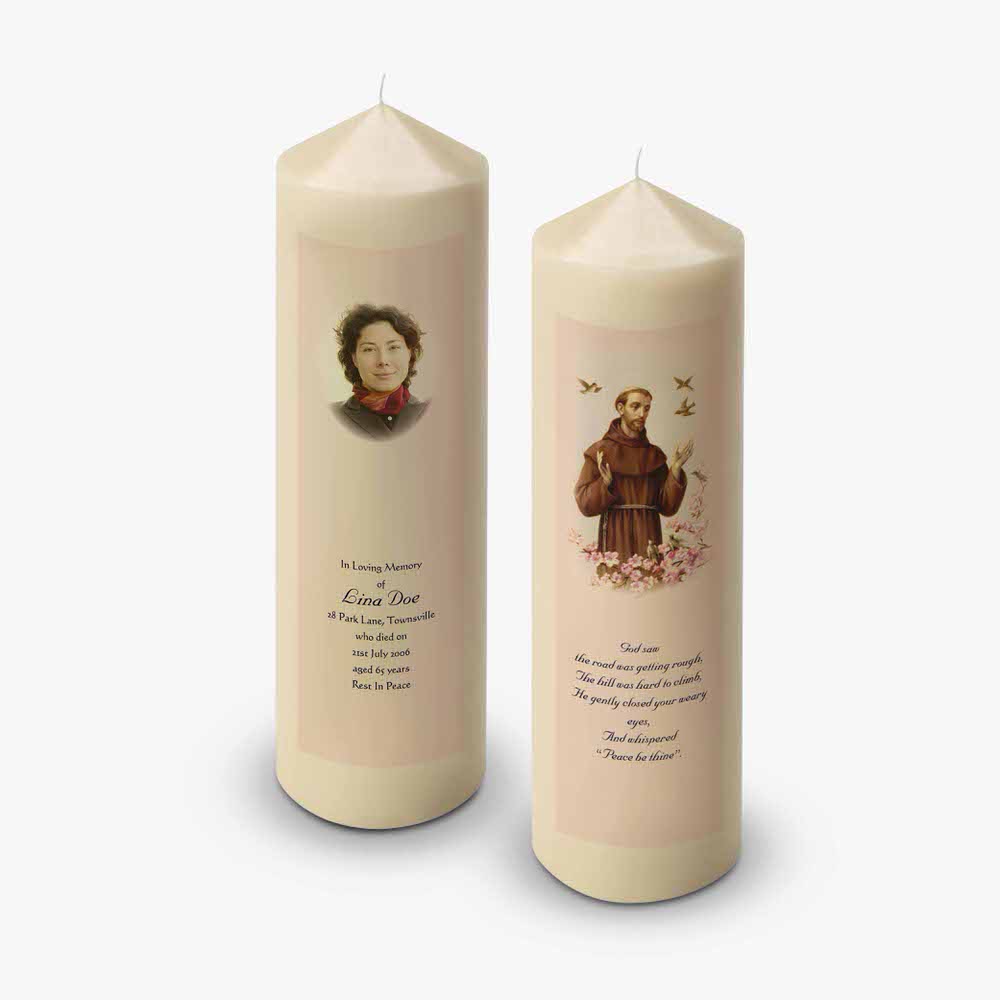 two candles with pictures of st francis and a woman