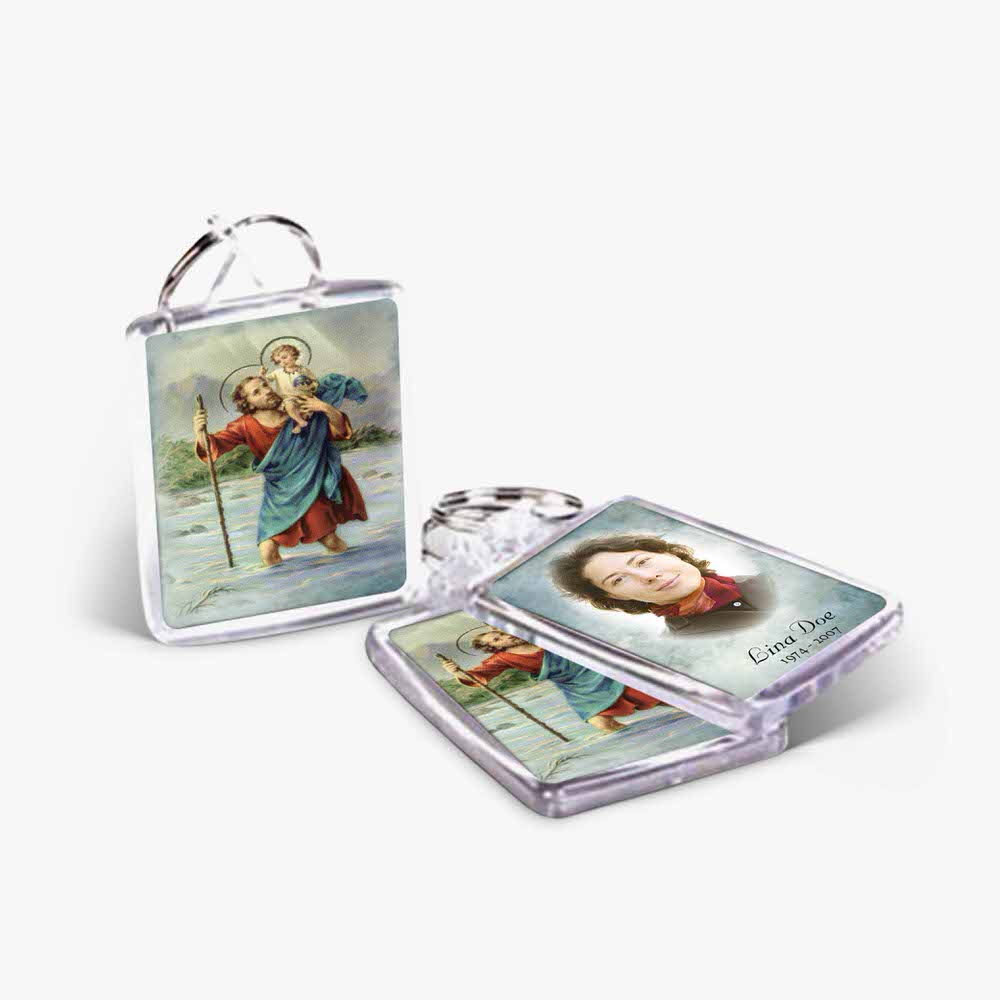 a key chain with a picture of jesus and a woman